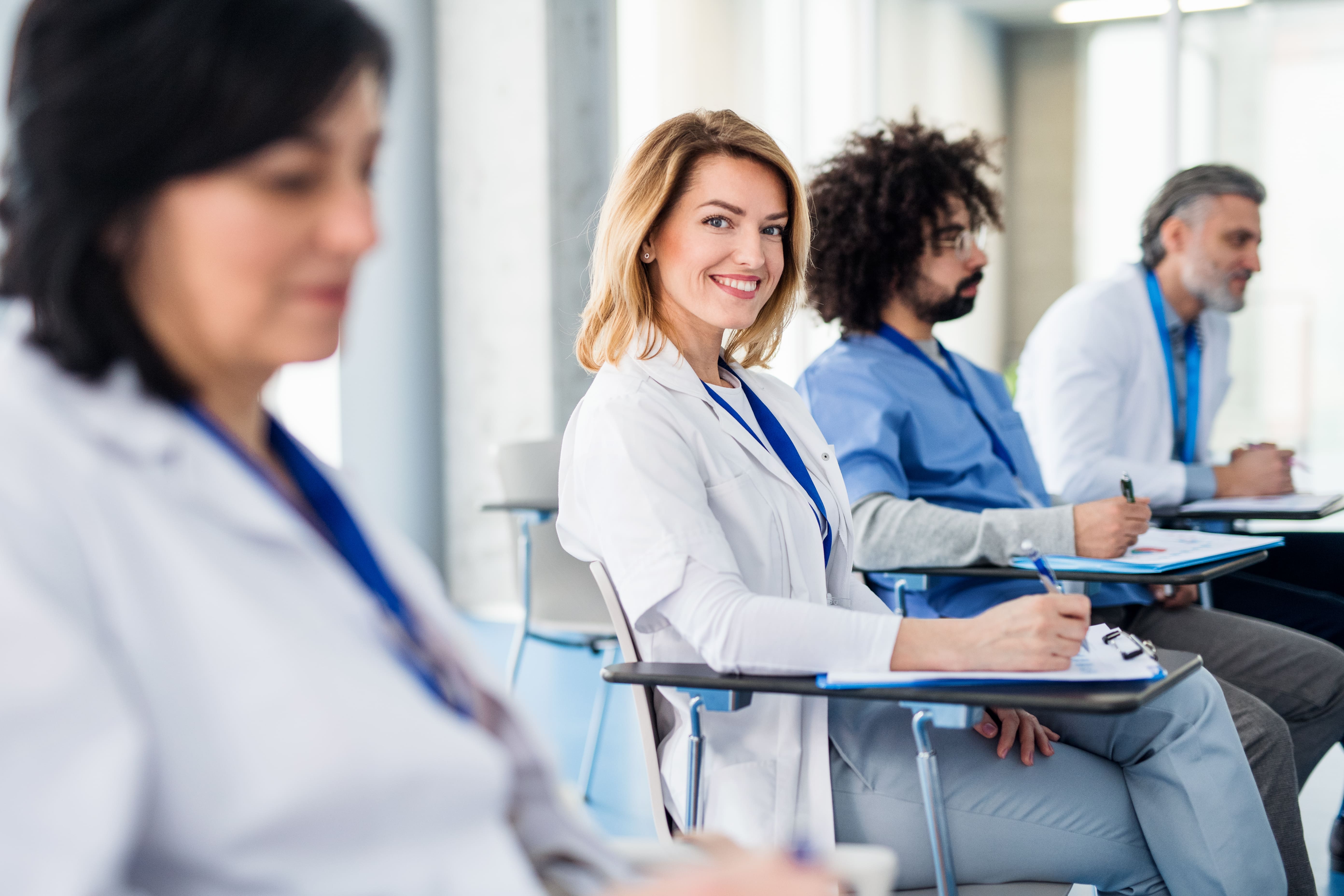 Physicians and clinical staff attending a GCP training session